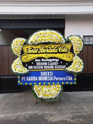 Papan Bunga Duka di Biuk